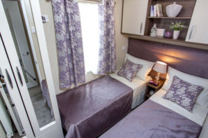 caravan bedroom purple in colour